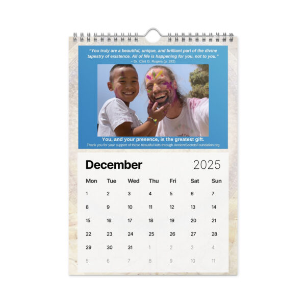 The Ancient Secrets Love Calendar (2025) includes a December page showcasing two joyful children, one with vibrant face paint, exuding youthful innocence and happiness.